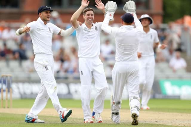 England's Chris Woakes celebrates taking the wicket of Pakistan's Azhar Ali. Picture: Martin Rickett/PA.