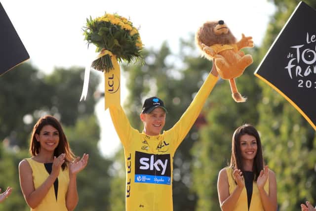 Team Sky's Chris Froome celebrates as he collects the yellow jersey for winning the Tour De France for a third time. Picture: AP.