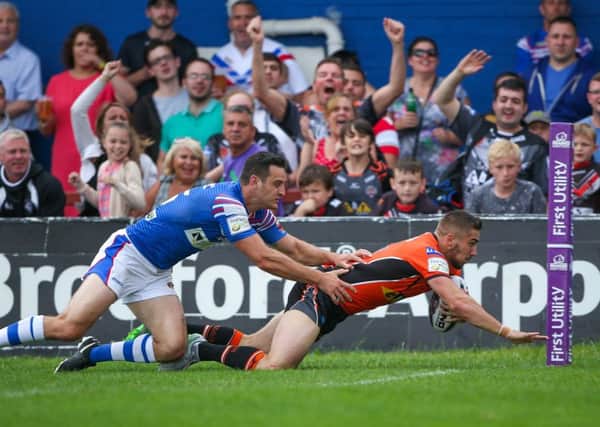 Castleford's Greg Minikin scores a try in Sunday's derby duel with Wakefield Trinity. Picture by Alex Whitehead/SWpix.com