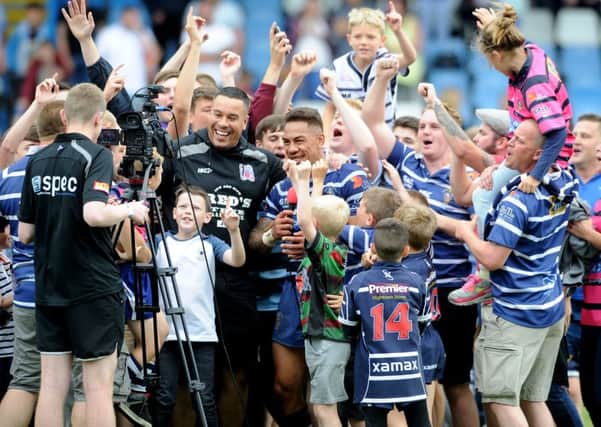 Misi Taulappa, celebrates with fans at the end of the match after Featherstone Rover beat Bradford Bull 20-0.  Picture James Hardisty