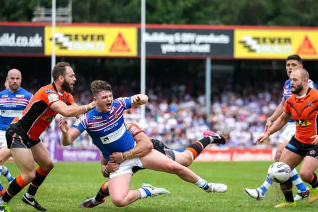 Wakefield's Jordan Crowther is tackled by Castleford's Frankie Mariano and Luke Gale. Picture: Alex Whitehead/SWpix.com