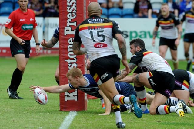 Featherstone Rovers Ian Hardman, reaches out to score a try. Picture James Hardisty.