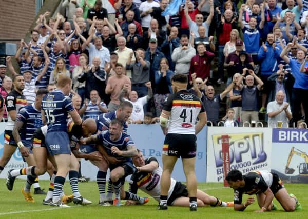 MAGIC MOMENT: Featherstone Rovers' players celebrate Anthony Thackeray's try against Bradford Bulls on Sunday. Picture James Hardisty.