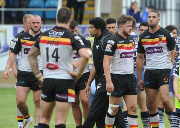 BAD DAY: Dejected Bradford Bulls' players show their disappointment after losing 20-0 to Featherstone Rovers. Picture James Hardisty.