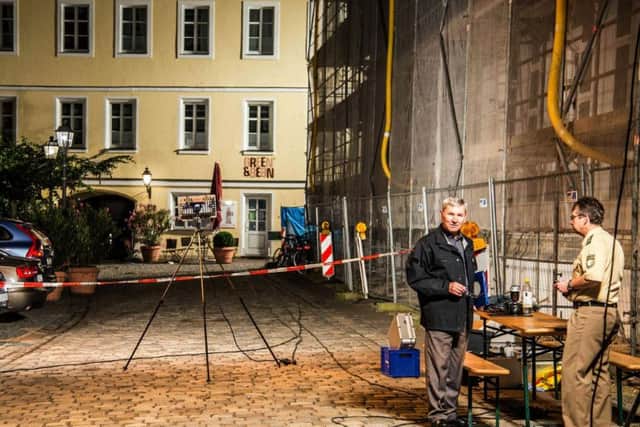 Special police officers examines the scene after an explosion occurred in Ansbach. (Friebe/dpa via AP)