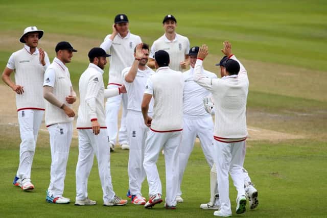 James Anderson celebrates with team-mates after bowling Pakistan's Shan Masood