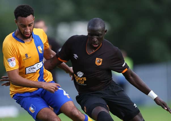 Hull City's Mo Diame, right, seen duelling with Mansfield Town's Rhys Bennett in a pre-season friendly (Picture: Barry Coombs/PA Wire).