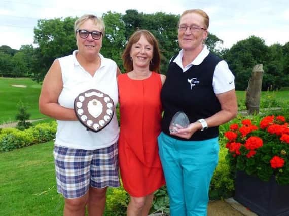 Tartan Trophy winner Elaine Mackie, right, with lady captain Gwyn Greenberry, centre, and best gross shield winner Carole Hampson.