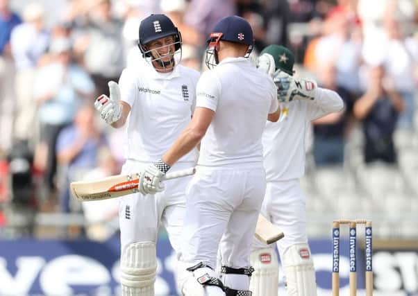 England's Joe Root celebrates his 250 against Pakistan with county team-mate Jonny Bairstow, during day two of the Second Investec Test match at Emirates Old Trafford, Manchester. (Picture: Martin Rickett/PA Wire)