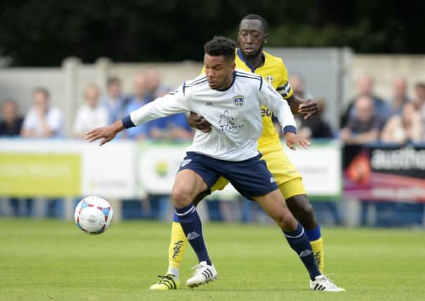 Oli Johnson holds off Tommi Diagouraga in the pre-season friendly against Leeds at Nethermoor.  Picture: Bruce Rollinson