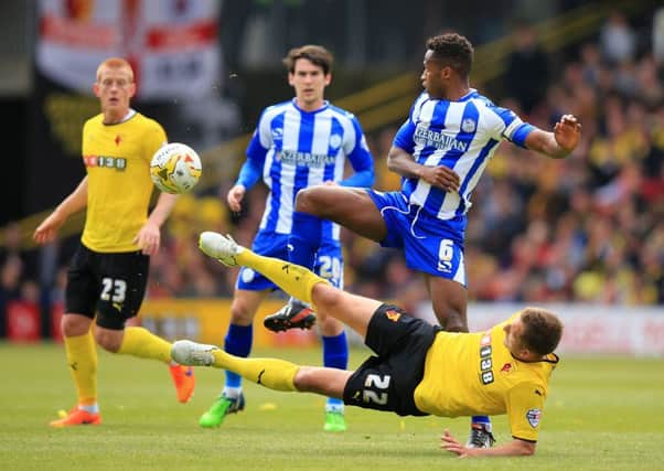 Watford's Almen Abdi (right) playing against Sheffield Wednesday, is a target for the Owls.