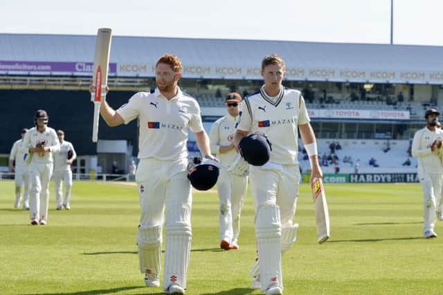 Jonny Bairstow and Joe Root come off for tea after taking Yorkshire's total to 362-3 against Surrey on May 9.  Picture: Bruce Rollinson.