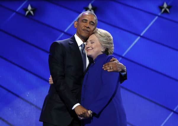 President Barack Obama hugs Democratic Presidential candidate Hillary Clinton after addressing the delegates during the third day session of the Democratic National Convention in Philadelphia.