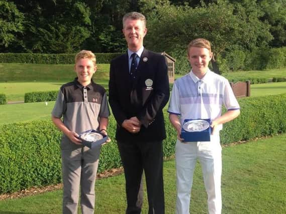 Yorkshire Under-14 champion Ben Schmidt and Under-16 Champion Michael Hay with Yorkshire Union of Golf Clubs' president Jonathan Plaxton.