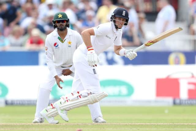 England's Joe Root hits out against Pakistan, during day one of the second Test match at Old Trafford. Picture: Martin Rickett/PA.
