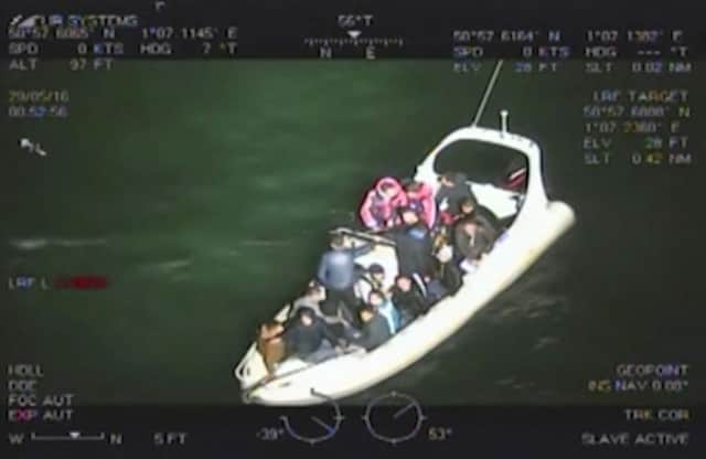 Handout video still of migrants on photo issued by the Home Office of on board the white rigid inflatable boat on the evening of May 28 this year. Mark Stribling  who along with Robert Stilwell has been jailed at Maidstone Crown Court after they tried to smuggle 18 Albanian immigrants into the UK. The pair admitted breaching immigration law by illegally attempting to help 18 migrants enter the country on a boat from France. Photo: Home Office/PA Wire