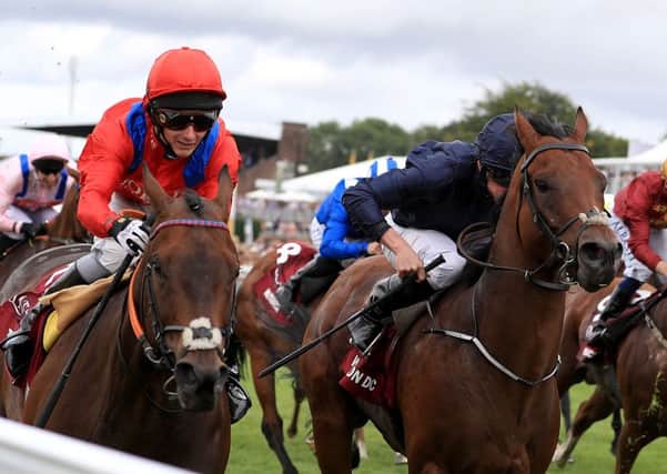 Take Cover (left) ridden by jockey David Allen (left) on the way to winning the Qatar King George Stakes during day four of The Qatar Goodwood Festival, at Goodwood racecourse.