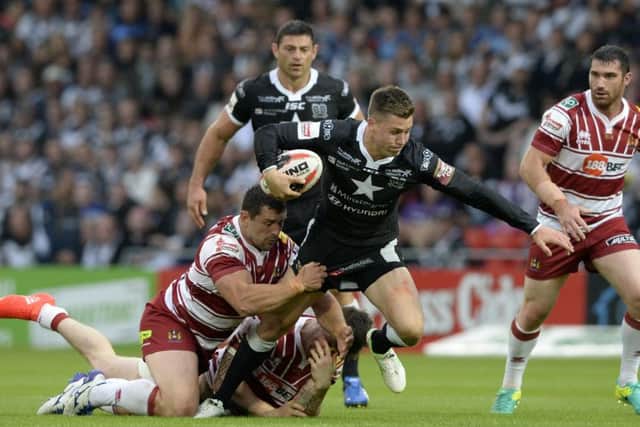 Marc Sneyd pushes on as Ben Flower holds on.
 (Picture: Bruce Rollinson)
