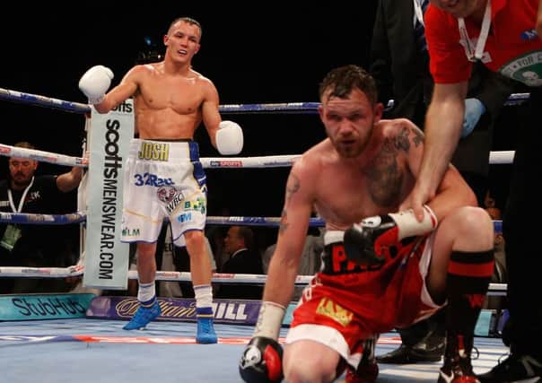 Winner: Josh Warrington celebrates victory at the First Direct Arena, Leeds. Picture: Danny Lawson/PA