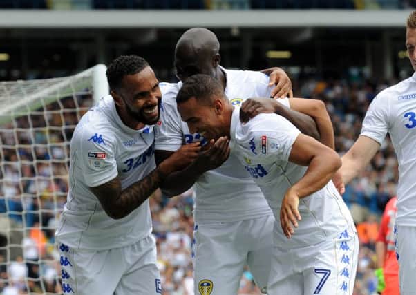 Kemar Roofe is congratulated by Sol Bamba and Kyle Bartley after scoring the winning goal.