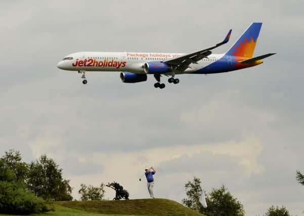A plane prepares to land at Leeds Bradford Airport.