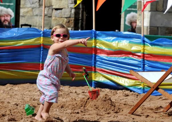 300716  Isla Forbes aged 20 months from York enjoying the urban beach in Coppergate York over the weekend.