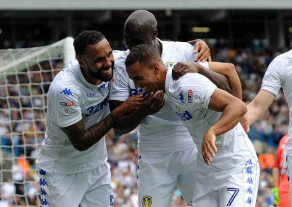 Kemar Roofe is Congratulated by Sol Bamba and Kyle Bartley after scoring the winning goal against Atalanta. Picture by Simon Hulme