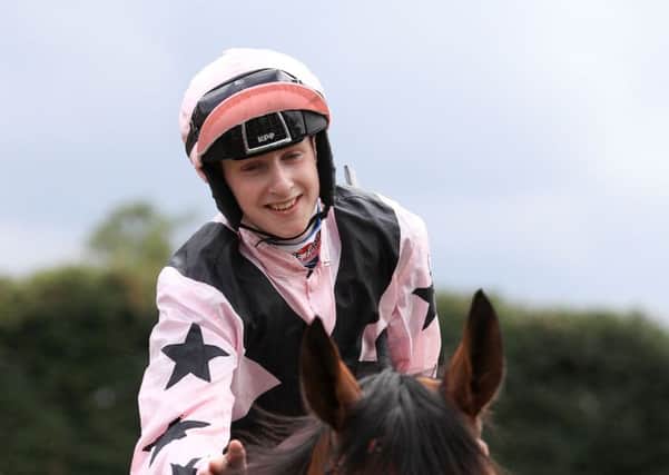 Nathan Evans smiles after winning the Qatar Stewards Handicap at Goodwood aboard Hoof It (Picture: John Walton/PA Wire).