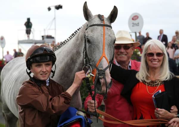 Dream Walker with (left to right) jockey Chris Hayes and owners Keith and Joan Brown in the parade ring after winning The Irish Stallion Farms European Breeders Fund  'Ahonoora'  Handicap  during day seven of the Galway Festival in Ballybrit, Ireland. PRESS ASSOCIATION Photo. Picture date: Sunday July 31, 2016. See PA story RACING Galway. Photo credit should read: Niall Carson/PA Wire