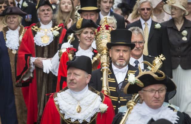 A town crier and a parade of Lord Mayors, Mayors and other Civic Heads from across Yorkshire make their way through Halifax during the Yorkshire Day Celebrations.