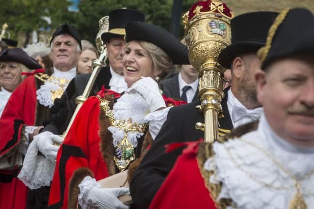 A town crier and a parade of Lord Mayors, Mayors and other Civic Heads from across Yorkshire make their way through Halifax during the Yorkshire Day Celebrations.