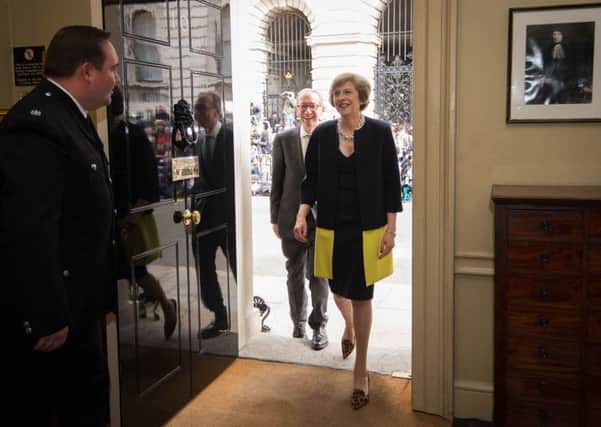 Theresa May enters 10 Downing Street for the first time as Prime Minister.