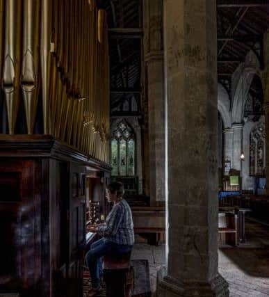 Cathy Otton-Goulder playing the restorted church organ.
Picture James Hardisty.