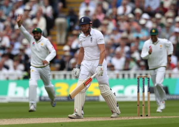 England's Jonny Bairstow shows his dejection after being dismissed for 12 by Pakistan's Sohail Khan.