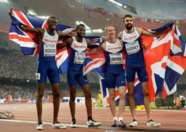 Rabah Yousif, left, joins Delano Williams, Jarryd Dunn and Martyn Rooney in celebrating bronze after finishing third in the Men's 4x400m relay final during day nine of the IAAF World Championships at the Beijing National Stadium, China. Photo: Adam Davy/PA Wire