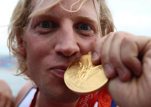 Great Britain's Andrew Triggs Hodge kisses his medal after winning gold during the mens four final at the Shunyi Olympic Rowing-Canoeing Park during the 2008 Beijing Olympic Games. Photo: Andrew Milligan/PA Wire.