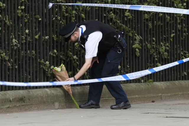 Police in Russell Square, central London, after a knife attack in which a woman in her 60s was killed and five people were injured. A 19-year-old man has been arrested.