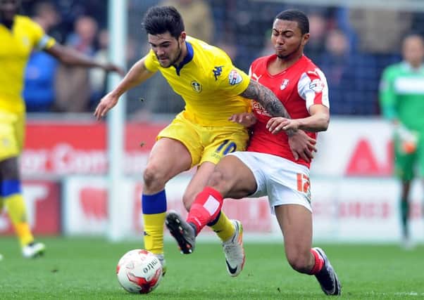 Leeds's Alex Mowatt tackled by Millers' Grant Ward.