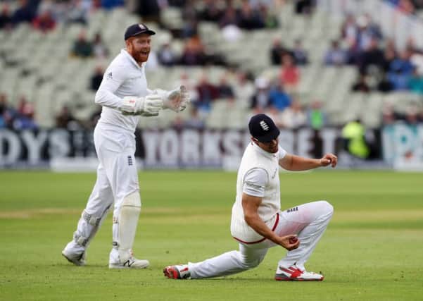 Englands captain Alastair Cook takes a catch on the final ball of the day to help dismiss Pakistans Azhar Ali (Picture: Nick Potts/PA Wire).