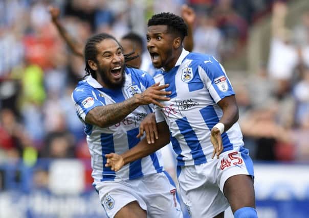 Huddersfield Town's Sean Scannell runs over to congratulate Kasey Palmer, who scored the winning goal against Brentford (Picture: James Hardisty).