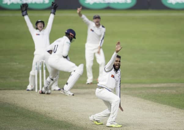 Yorkshire's Adil Rashid appeals successfully for LBW against Warwickshire's Keith Barker.