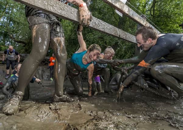 Competitors taking part in the Tough Mudder event held at Broughton Hall, near Skipton, North Yorkshire.
Picture James Hardisty.