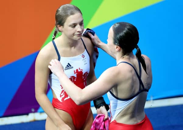 Alicia Blagg, left, looks disconsolate after she and her partner Rebecca Gallantree, the two City of Leeds divers, came up short in their bid for a medal in the 3m synchro competition at the Olympics (Picture: PA).
