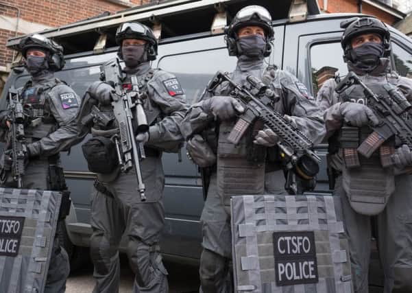 Armed police prepare to deploy in Hyde Park, London, because of the terrorist threat.