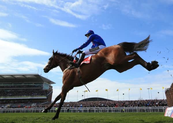Cue Card winning at Aintree in April.