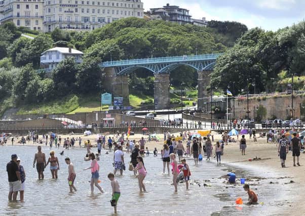 Visitors to Scarborough's South Bay enjoy the sunshine