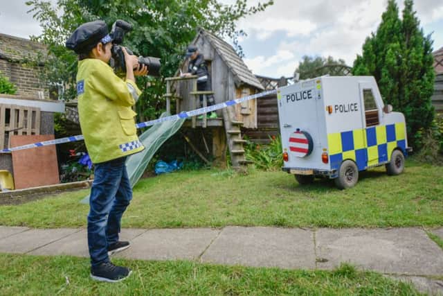 Frankie Robinson built a miniature police car with dad Allan. Picture: Ross Parry Agency