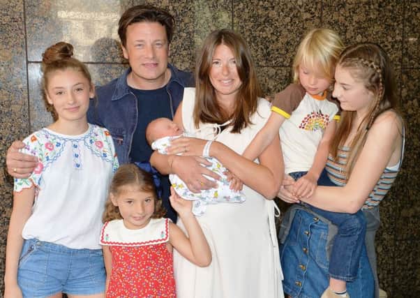 Jools and Jamie Oliver leave the Portland Hospital, London with the newest addition to the Oliver family, a baby boy and their older children (left to right) Daisy Boo Pamela, Petal Blossom Rainbow, Buddy Bear Maurice and Poppy Honey Rosie.  Photo: John Stillwell/PA Wire