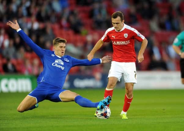 John Stones, left, pictured playing for Everton against former club Barnsley. He has now moved on to Manchester City (Picture: Tony Johnson).