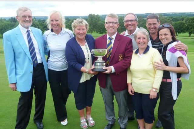 Otley, winners of the Oakdale Jubilee Trophy, with Harrogate Union president Robin Elias.